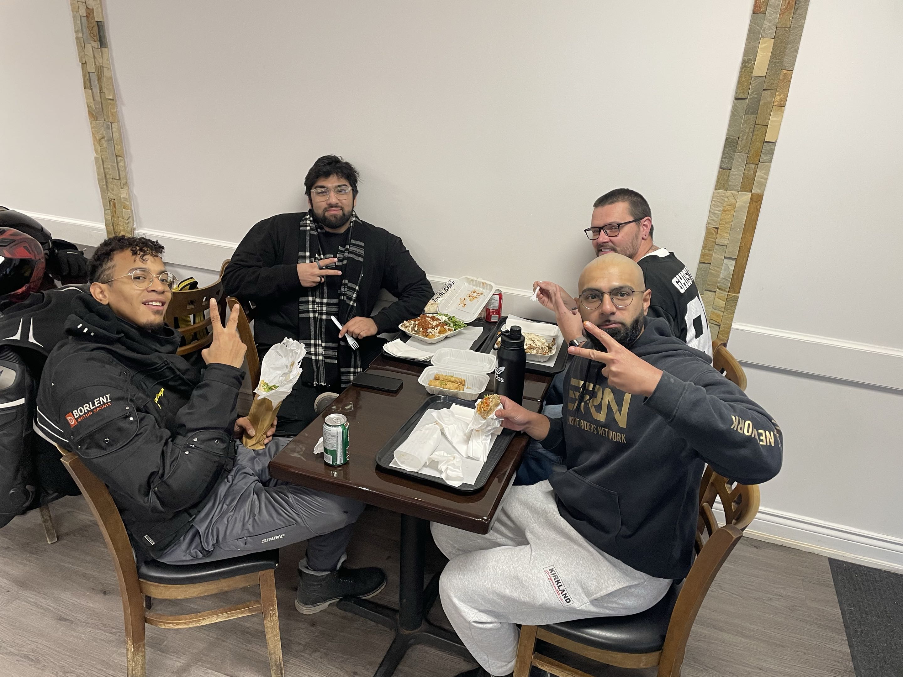 The crew enjoying food together at a pit stop