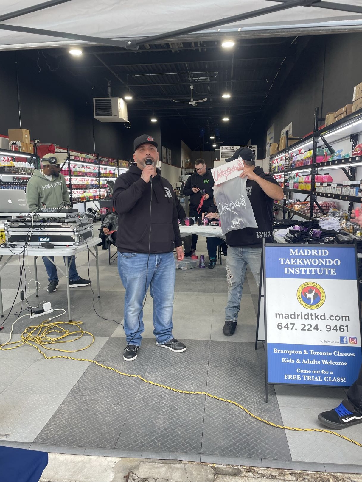 MC hosting the raffle and event on the mic