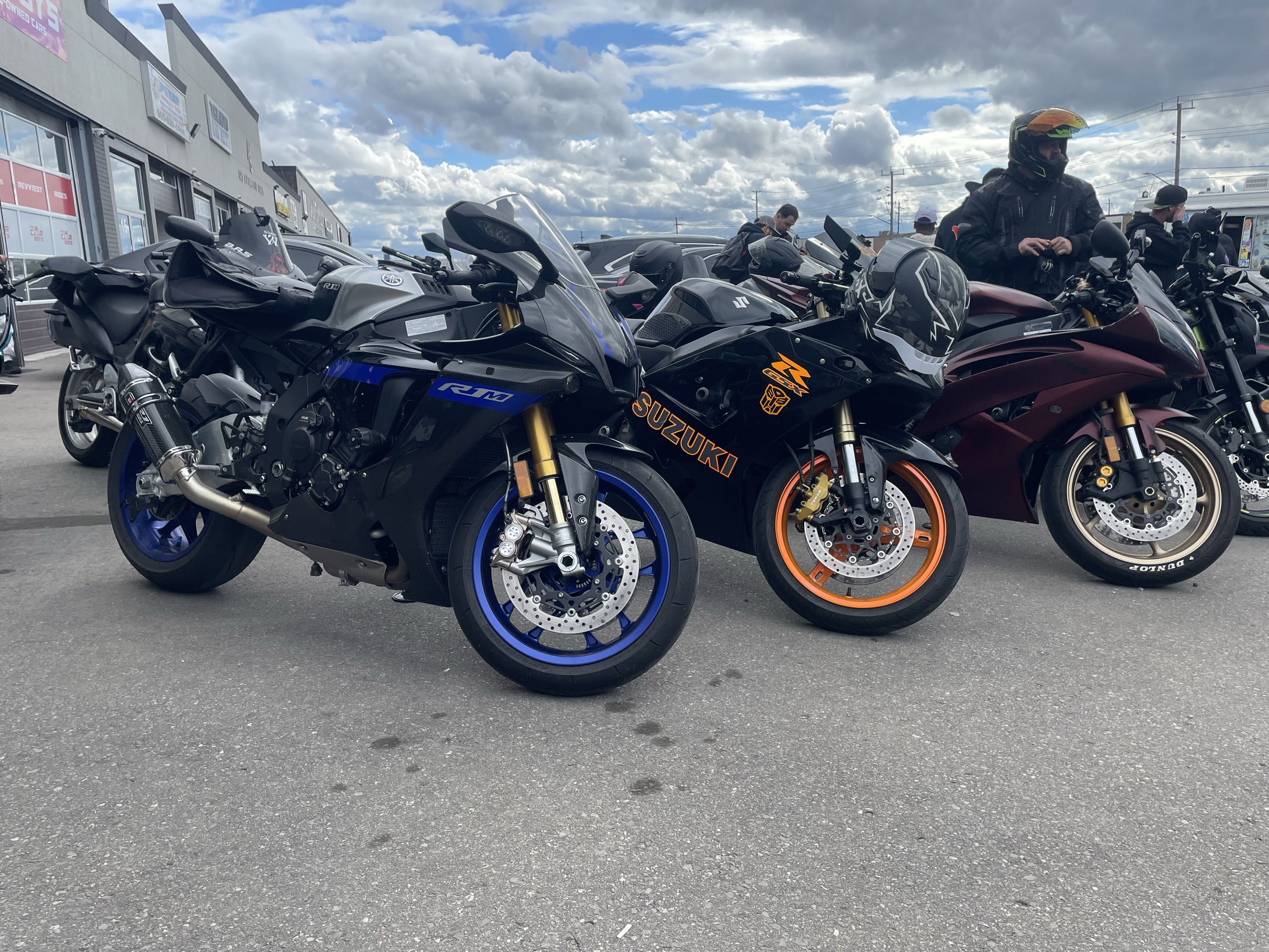 Row of sport bikes including Yamaha R1M and Suzuki GSX-R